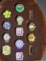 Entire set of 11 ring watches displayed on board