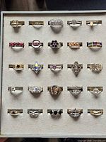 Tray showing 25 assorted costume rings front view