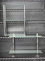 Both tempered glass chrome wall shelves showing overall design and size difference