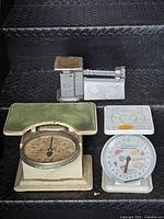 All three vintage scales on steps