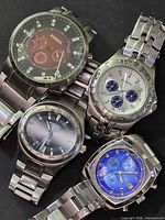 Group shot of four Fossil stainless wristwatches
