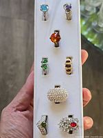 All eight rings displayed vertically on holder