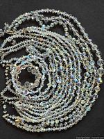 All eight necklaces coiled to show full lot