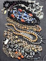 Full lot overview of assorted bead necklaces