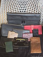 group shot of all wallets and clutches
