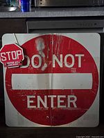 Front view of both signs showing design and wear