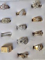 Front view of all twelve rings in display tray