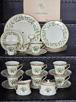 Full view of entire 23-piece Lenox Holiday tea service with original dessert server box