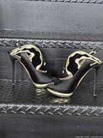 Full side profile of both pumps showing design, heel height and platform