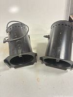 Both PAR can lights showing exterior, cords, and yokes