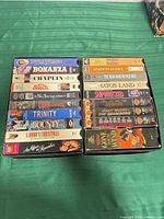 Two vertical stacks of VHS tapes showing most titles