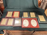ten of the assorted picture frames laid out showing different sizes colors and finishes
