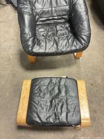 Top view of lounge chair and ottoman showing design and wear