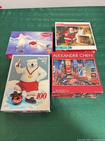 Group shot of all four Coca-Cola puzzle boxes