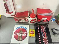 Full lot showing boxed paper towel holder, cooler bag, jug, tray, sign, playing cards, lanyard