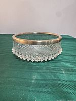 oblique view showing bowl profile, cut pattern and silver rim