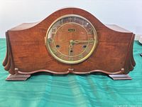 Front view of Forestville tambour mantel clock showing wood case and dial
