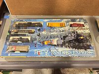 Boxed HO scale Insiders Express train set showing all included locomotive, cars and accessories in tray