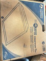 Sealed Lithonia Lighting 2×2 lay-in troffer box top showing model and specifications