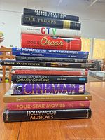 Stack of the 15 hardcover books showing spines and titles