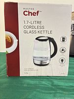 Retail box showing Master Chef 1.7-Litre Cordless Glass Kettle and key features