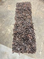 Full view of runner rug top side showing length and leather strip surface