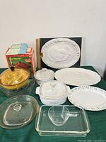 Group shot of bun warmer, casseroles, platters, original box