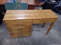 Angled overview of wood worktable showing overall structure and finish