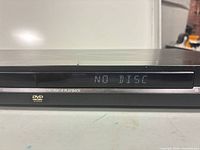 Front display showing unit powered on "NO DISC"