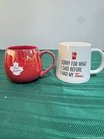Two Tim Hortons ceramic mugs showing colors, logos and condition