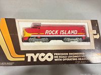 Front of boxed Tyco Rock Island locomotive in foam insert