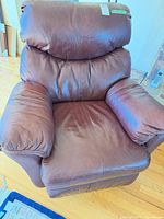 Front angled view of brown leather Elran recliner