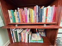 Both shelves of assorted books visible