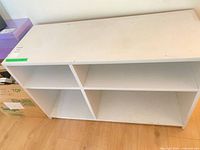 Front angled view of full bookshelf showing four cubbies and top surface