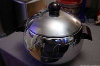 Overall view of West Bend Penguin server with lid on showing handles and penguin motif