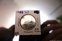 Reverse of 1963 Canadian quarter in holder