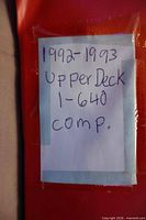 Handwritten note reading 1992-1993 Upper Deck 1-640 comp affixed to red binder