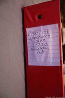 Red binder spine with handwritten label noting 1998-1999 Upper Deck MVP complete set