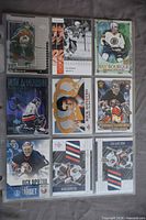 Front view of first nine hockey cards in sleeve including Messier, Yashin, Bourque, DiPietro