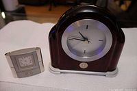 Both clocks front view showing sizes and styles