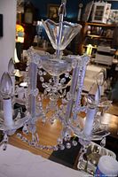 Full view of five-arm crystal chandelier hanging