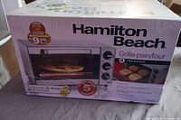 Factory-sealed box front showing product image and features