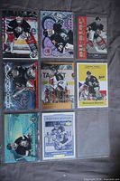 Fronts of eight Dominik Hasek cards in album page