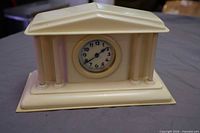 Front view of Par-a-Lux French Ivory temple clock showing dial and case