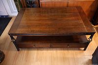 Top view showing full rectangular wood surface and lower shelf with drawers