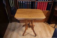 Full view of console table showing top, base, and casters