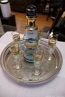 Full set on tray showing decanter, five glasses, tray