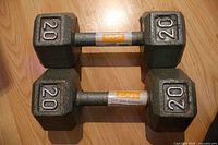 Both 20 lb CAP cast iron dumbbells top view showing hex heads