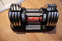 Top view showing adjustable dumbbell with chrome plates and base