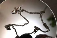 Full view of sterling chain and bird pendant